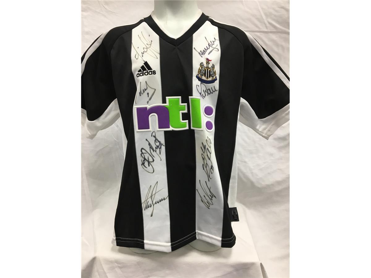 Lot 639 - A Newcastle United home shirt signed by the